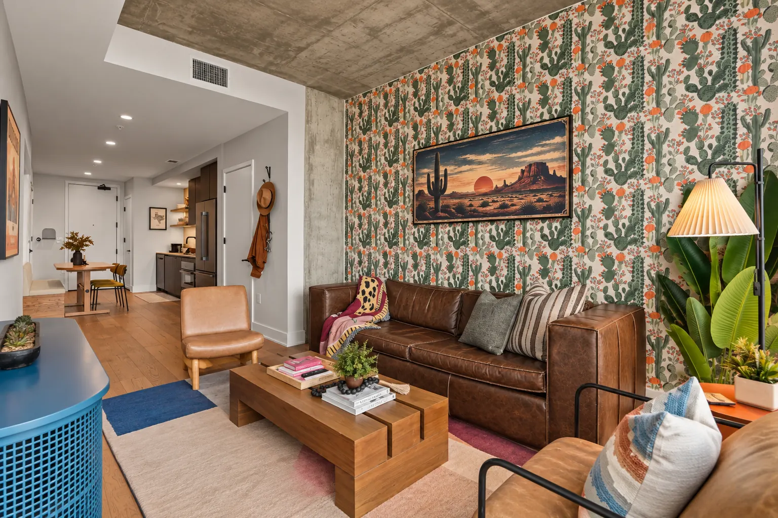 Living room from the sofa, with a wood coffee table and the entry and dining area beyond